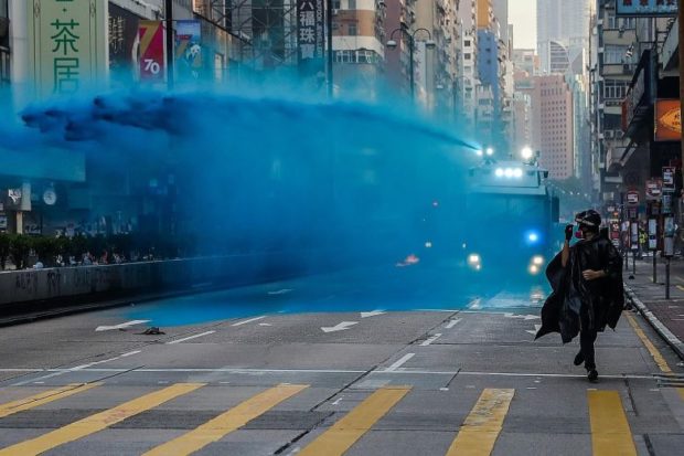Pitched street battles across Hong Kong; shops vandalized, torched