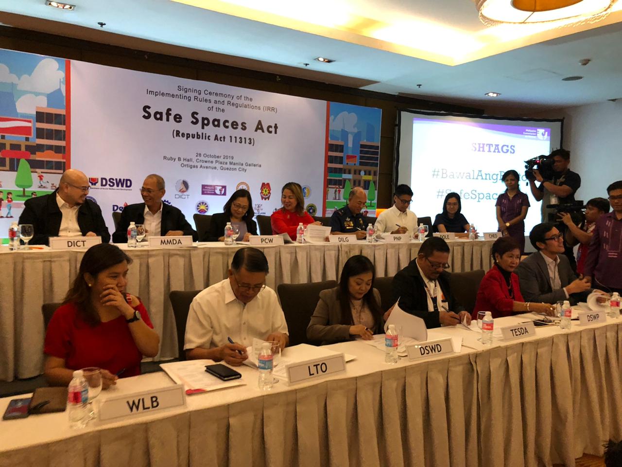 Officials from concerned government agencies and women’s organizations sign the implementing rules and regulations of the Safe Spaces Act or the “Bawal Bastos” law on Oct. 28, 2019 (Photo by Daphne Galvez/ INQUIRER.net