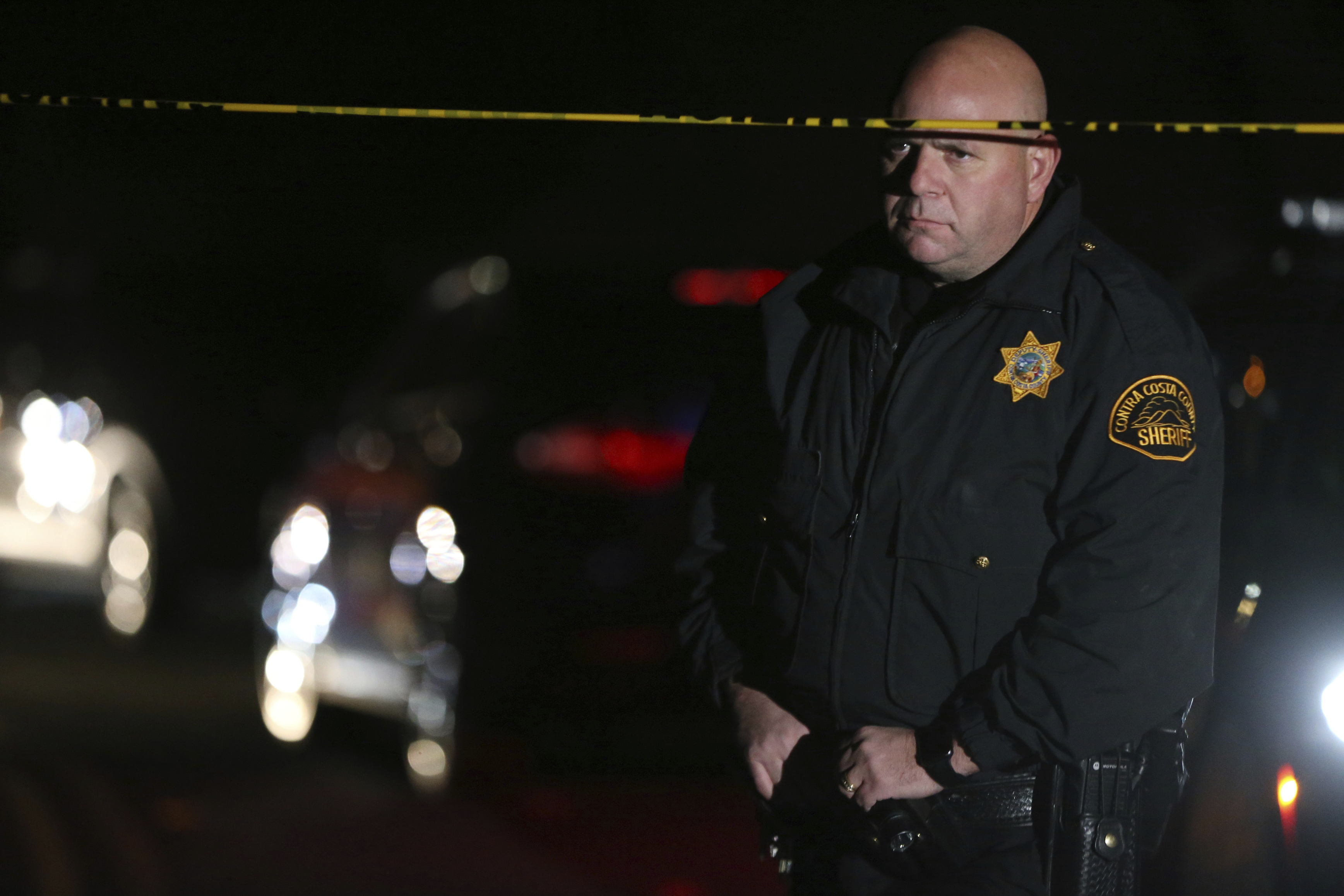 Contra Costa County Sheriff deputies investigate a multiple shooting in Orinda, Calif., on Thursday, Oct. 31, 2019. Four people were killed and four others wounded in a Halloween night party shooting at a large rental home in a wealthy San Francisco Bay Area community, police said Friday.  The shooting in the city of about 20,000 just east of Berkeley, happened at a party attended by 100 people said police chief David Cook. (Ray Chavez/East Bay Times via AP)