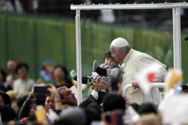 Pope Francis rides in carbon-free popemobile in Japan