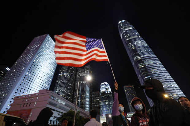 China furious, Hong Kong celebrates after US move on bills