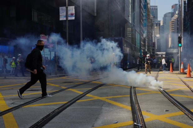 Man set on fire during chaotic Hong Kong day