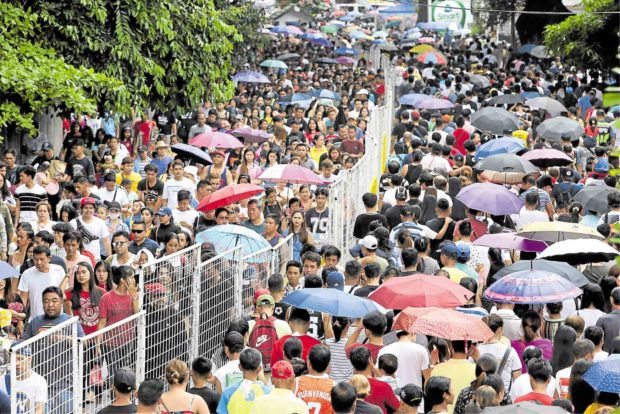 Pinoys pack cemeteries to remember the dead
