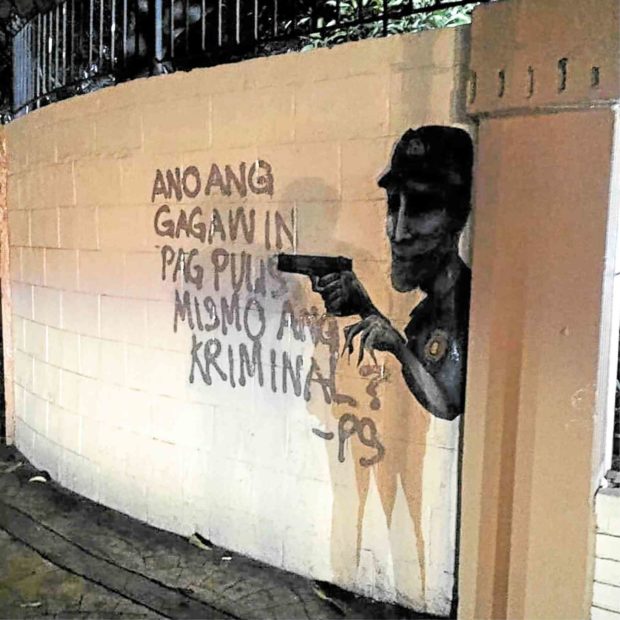 Vandalism or art? Spray-painted messages irk Manila bureau
