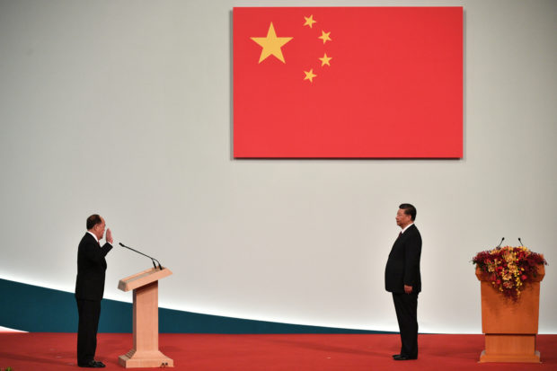 Xi revels in patriotic Macau handover party as Hong Kong simmers