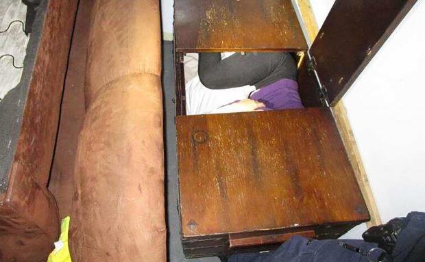 Chinese migrant in wooden chest
