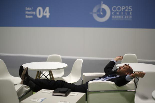 Visitors rests at the COP25 climate talks in Madrid