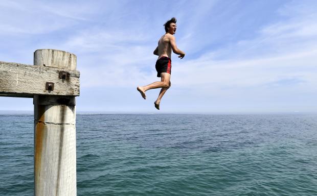 Swimmer jumps off jetty in Adelaide