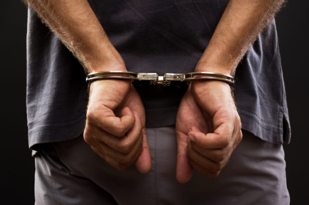 Man in handcuffs arrest shabu drugs
