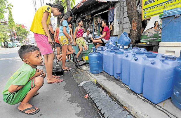 30 WATER WOES The taps went dry in Metro Manila and nearby provinces, as the dry months drained La Mesa dam, resulting in long lines of residents waiting for water ration from firetrucks. December 9, 2019 —EDWIN BACASMAS