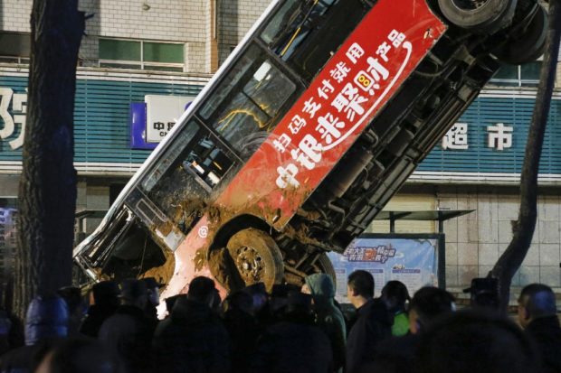 Huge sinkhole swallows bus, kills six in China