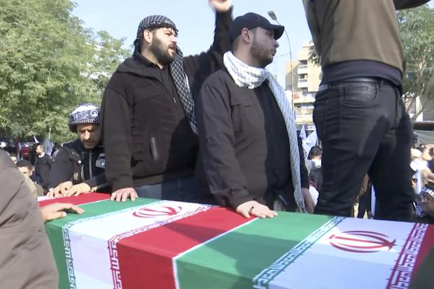 Mourners beside coffin of slain Iranian general Qassem Soleimani