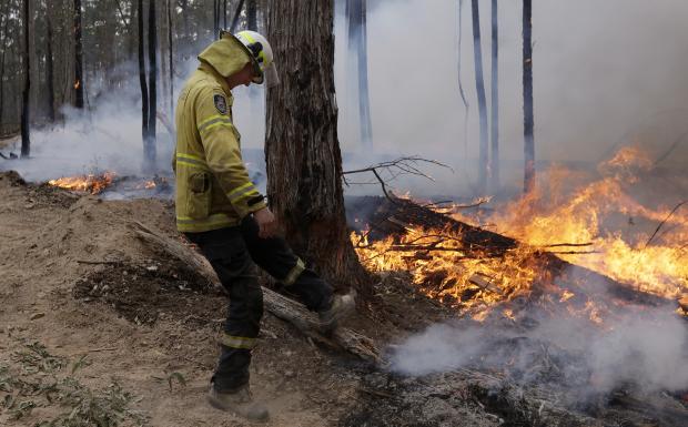 Firefighter at containment line in Australia forest