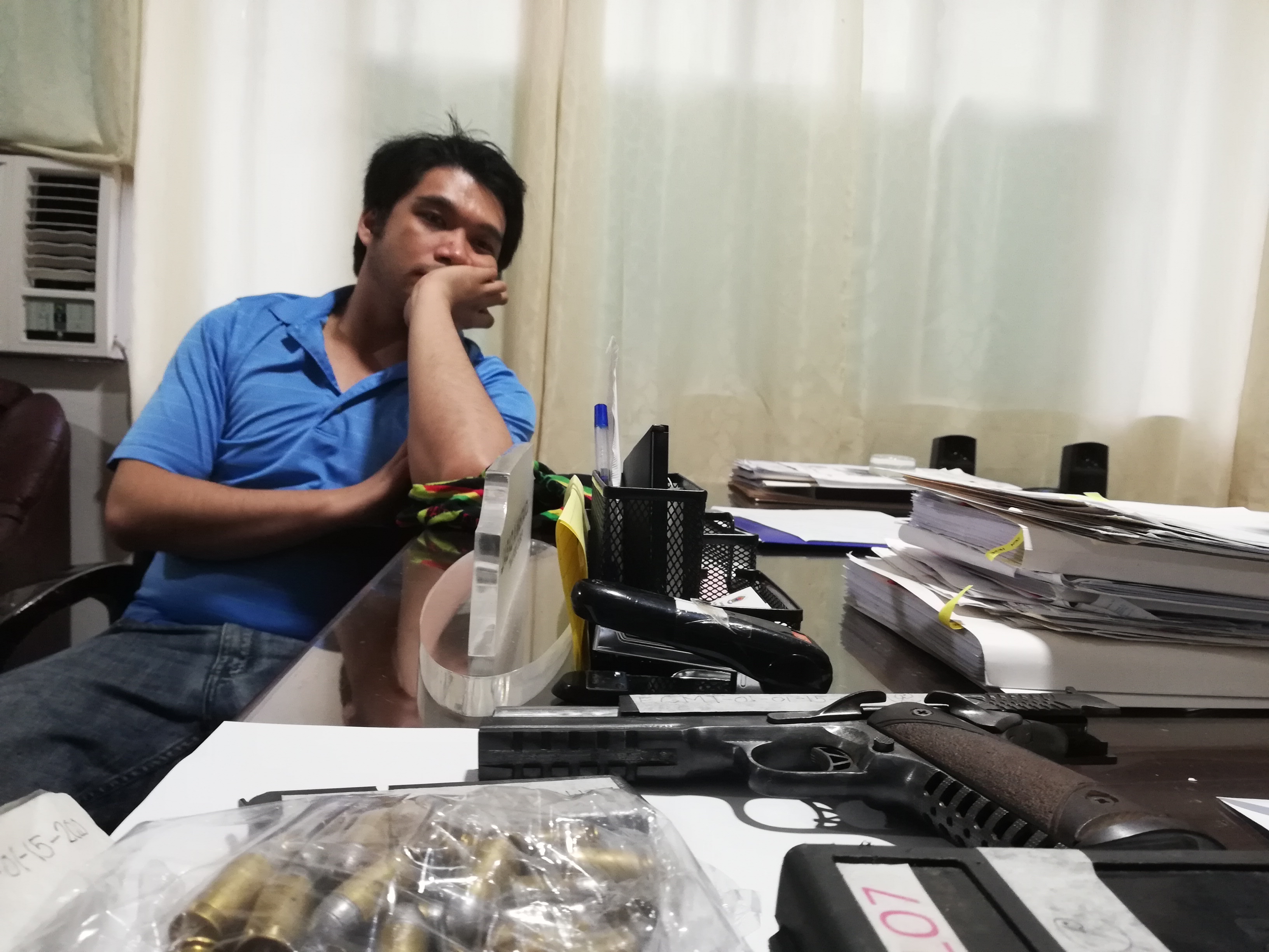 Elpren Charles "Bobec" Tungol, 32, a former mayor of Alburquerque town was arrested on Wednesday for illegal possession of firearms and ammunition. He was also tagged as the suspect in the killing of Wilfrido Plaza, a barangay councilor and trusted aide of incumbent Alburquerque Mayor Don Ritchie Buates. (Photo by Helen Castaño)