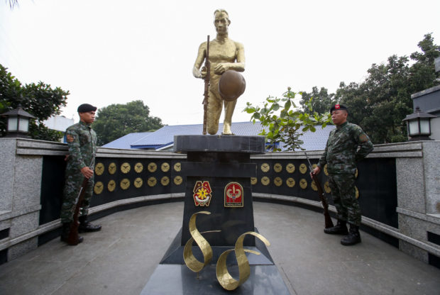 SAF members stand guard at the “Pagpupugay” sculpture, a memorial in honoring the 44 SAF commandos killed in the 2015 Mamasapano, Maguindanao, operation. STORY: Also remember the 23 Moros who died in Mamasapano – Moro leader
