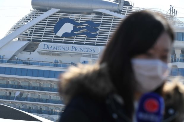 The Diamond Princess cruise ship, in quarantine due to fears of new COVID-19 coronavirus, is seen at Daikoku pier cruise terminal in Yokohama on February 21, 2020. - Hundreds of people have been allowed to leave the ship after testing negative for the disease and many have returned to their home countries to face further quarantine. (Photo by Philip FONG / AFP)