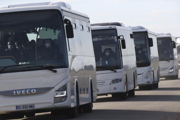  French evacuees in bus after arrival from China