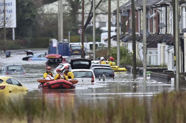 Rescued citizen on boat in flood Wales area