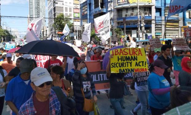 Protesters march to mark 34th anniversary of People Power