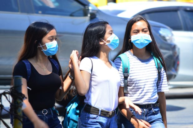 Students wearing face masks. STORY: Mask rule stays until end of my term – Duterte