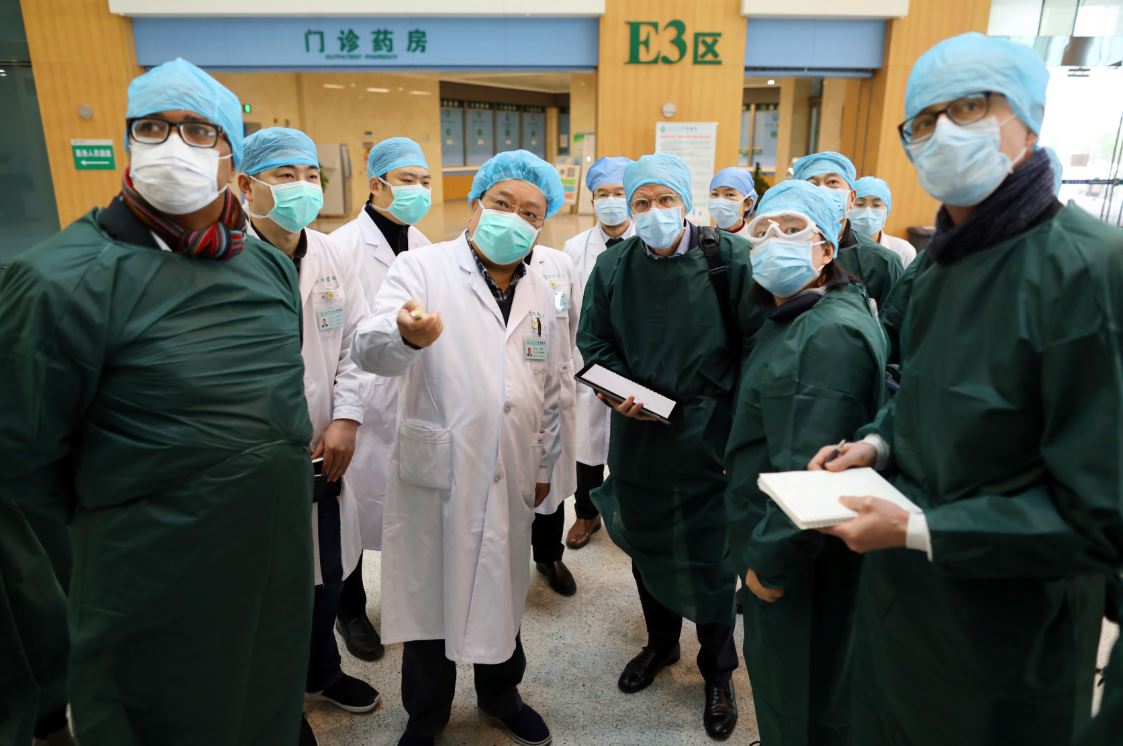 A team of novel coronavirus pneumonia experts from China and the World Health Organization visit the Guanggu branch of Tongji Hospital in Wuhan, Central China's Hubei province, Feb 23, 2020.