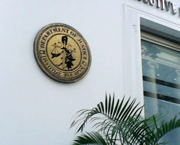 Construction workers recover human bones at a construction site inside the main office of the DOJ