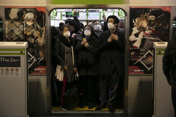 Commuters wearing mask in Japan subway train
