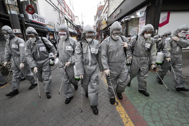 Army soldiers spraying disinfectant in Seoul