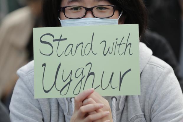 Man at a rally in support of Uighurs