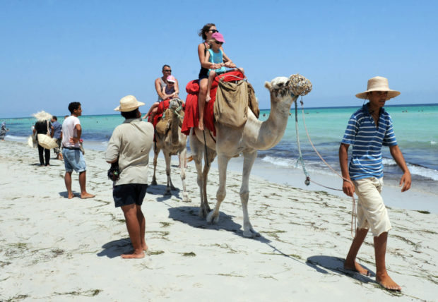 tunisia camels tourists