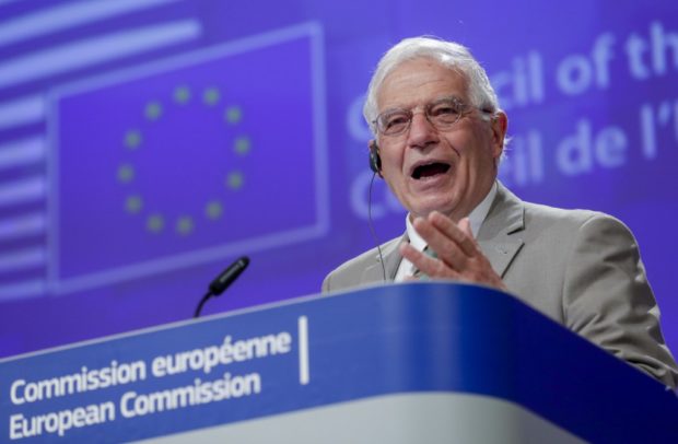 The European Union on Thursday warned the Taliban that it would face being cut off by the international community if it seized power through violence, as the insurgents sweep across Afghanistan.