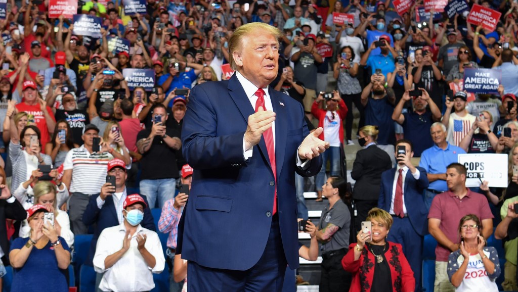 US President Donald Trump arrives for a campaign rally at the BOK Center on June 20, 2020 in Tulsa, Oklahoma. - Hundreds of supporters lined up early for Donald Trump's first political rally in months, saying the risk of contracting COVID-19 in a big, packed arena would not keep them from hearing the president's campaign message. (Photo by Nicholas Kamm / AFP)