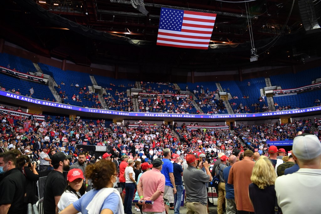 The upper section of the arena is seen partially empty as US President Donald Trump speaks during a campaign rally at the BOK Center on June 20, 2020 in Tulsa, Oklahoma. - Hundreds of supporters lined up early for Donald Trump's first political rally in months, saying the risk of contracting COVID-19 in a big, packed arena would not keep them from hearing the president's campaign message. (Photo by Nicholas Kamm / AFP)