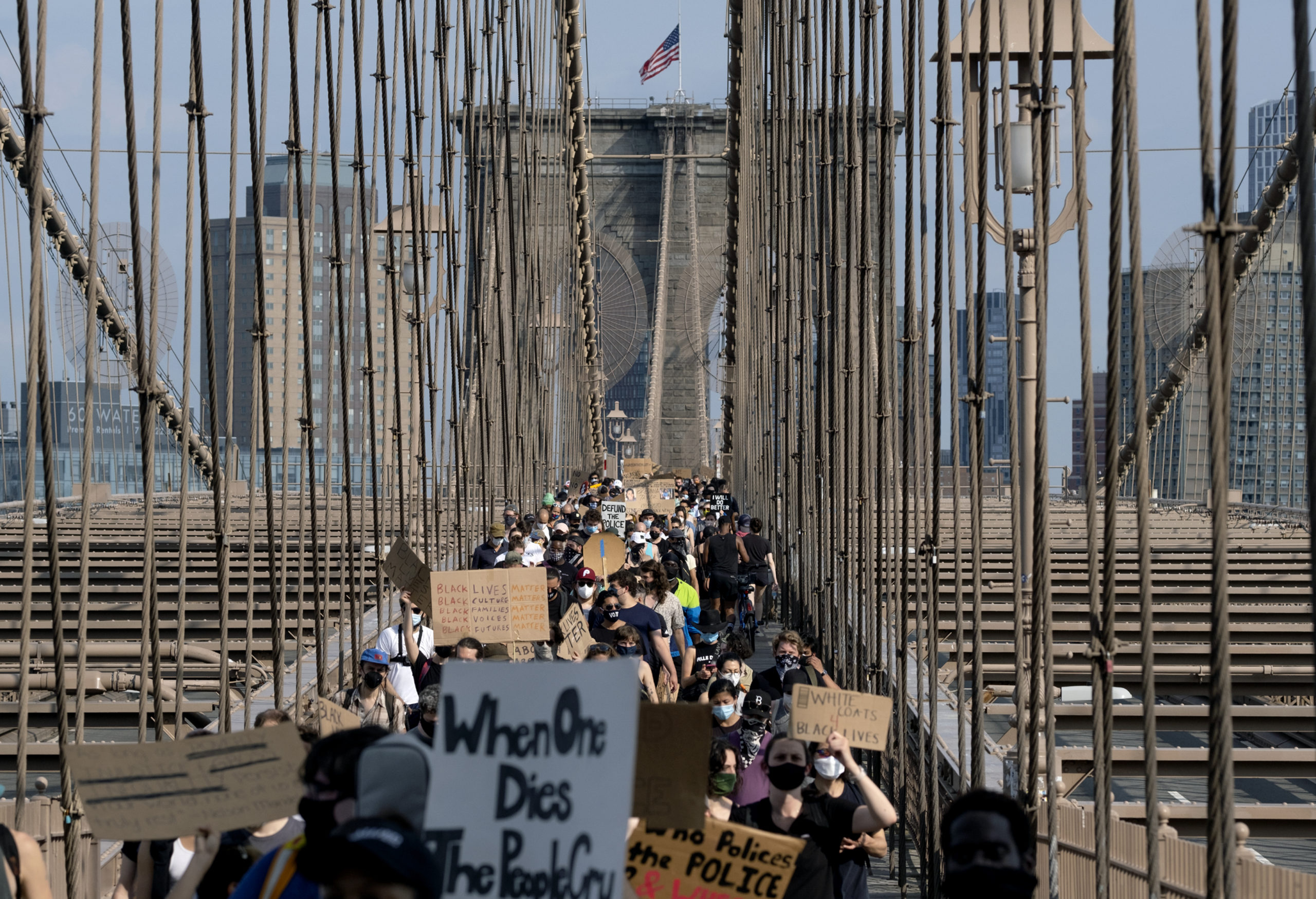 Protesters and activists walk across the Brooklyn Bridge, Saturday, June 6, 2020, in New York. Protests continued following the death of George Floyd, who died after being restrained by Minneapolis police officers on May 25. (AP Photo/Craig Ruttle)