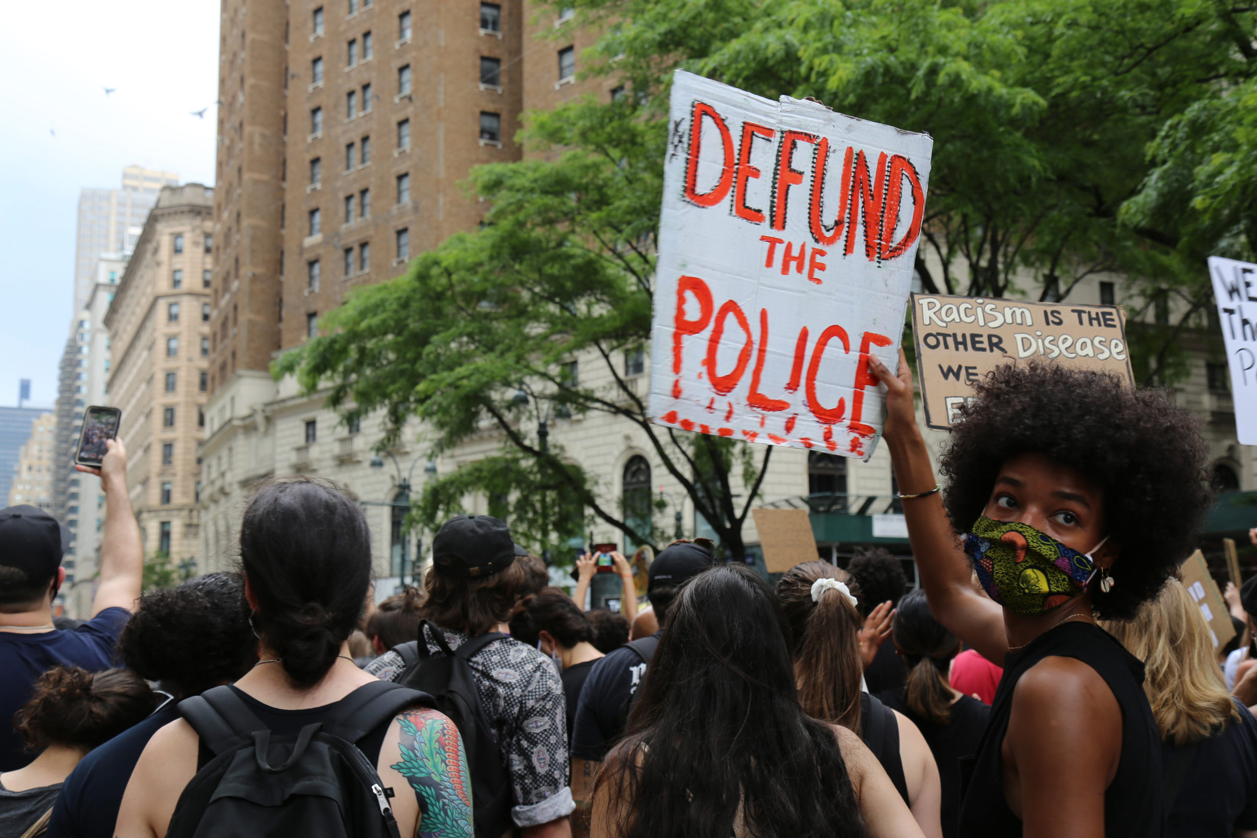 defund the police Protesters march Saturday, June 6, 2020, in New York. Demonstrations continue across the United States in protest of racism and police brutality, sparked by the May 25 death of George Floyd in police custody in Minneapolis. (AP Photo/Ragan Clark)