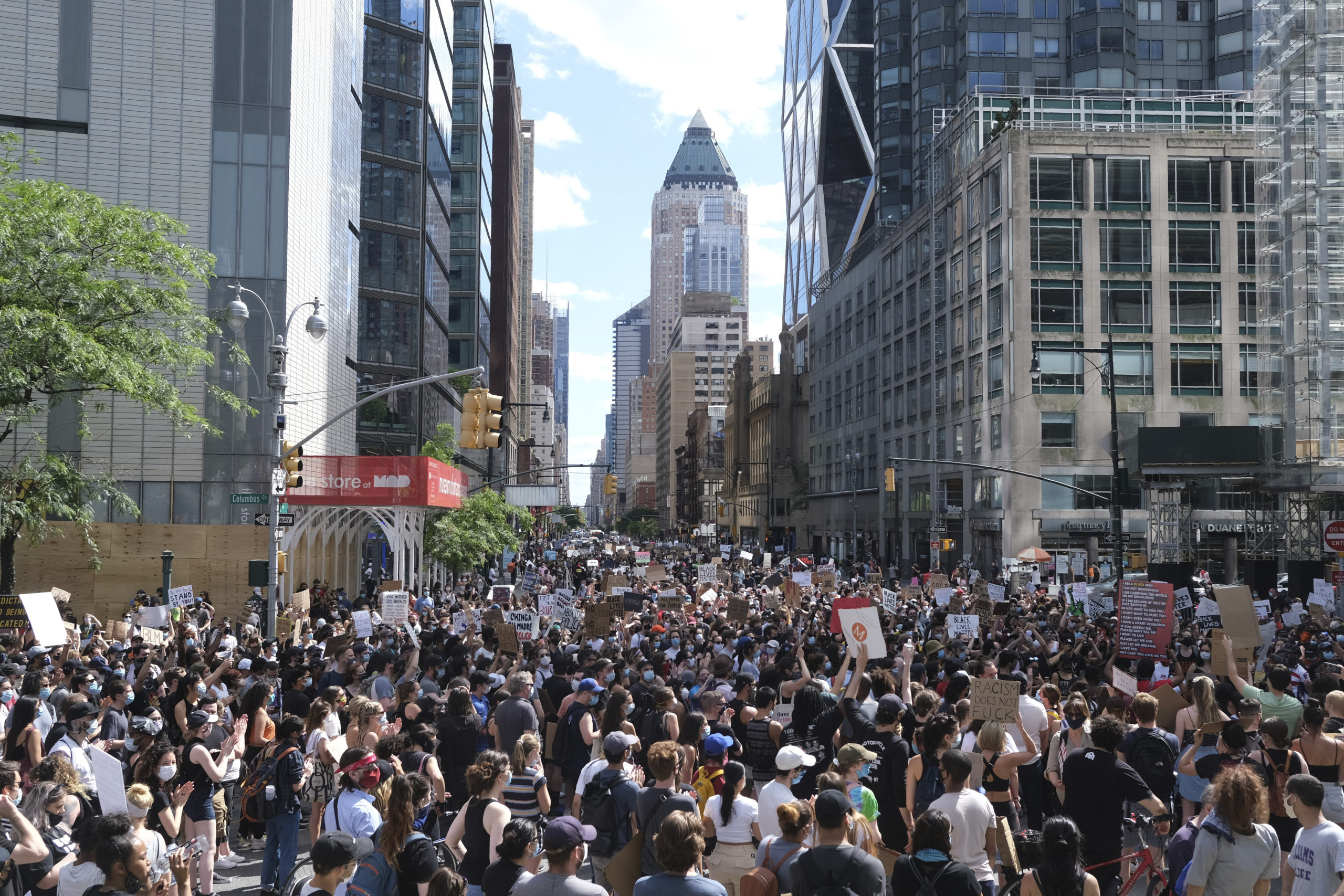 Protesters march through the streets of Manhattan, New York, Sunday, June 7, 2020. New York City lifted the curfew spurred by protests against police brutality ahead of schedule Sunday after a peaceful night, free of the clashes or ransacking of stores that rocked the city days earlier. (AP Photo/Seth Wenig)