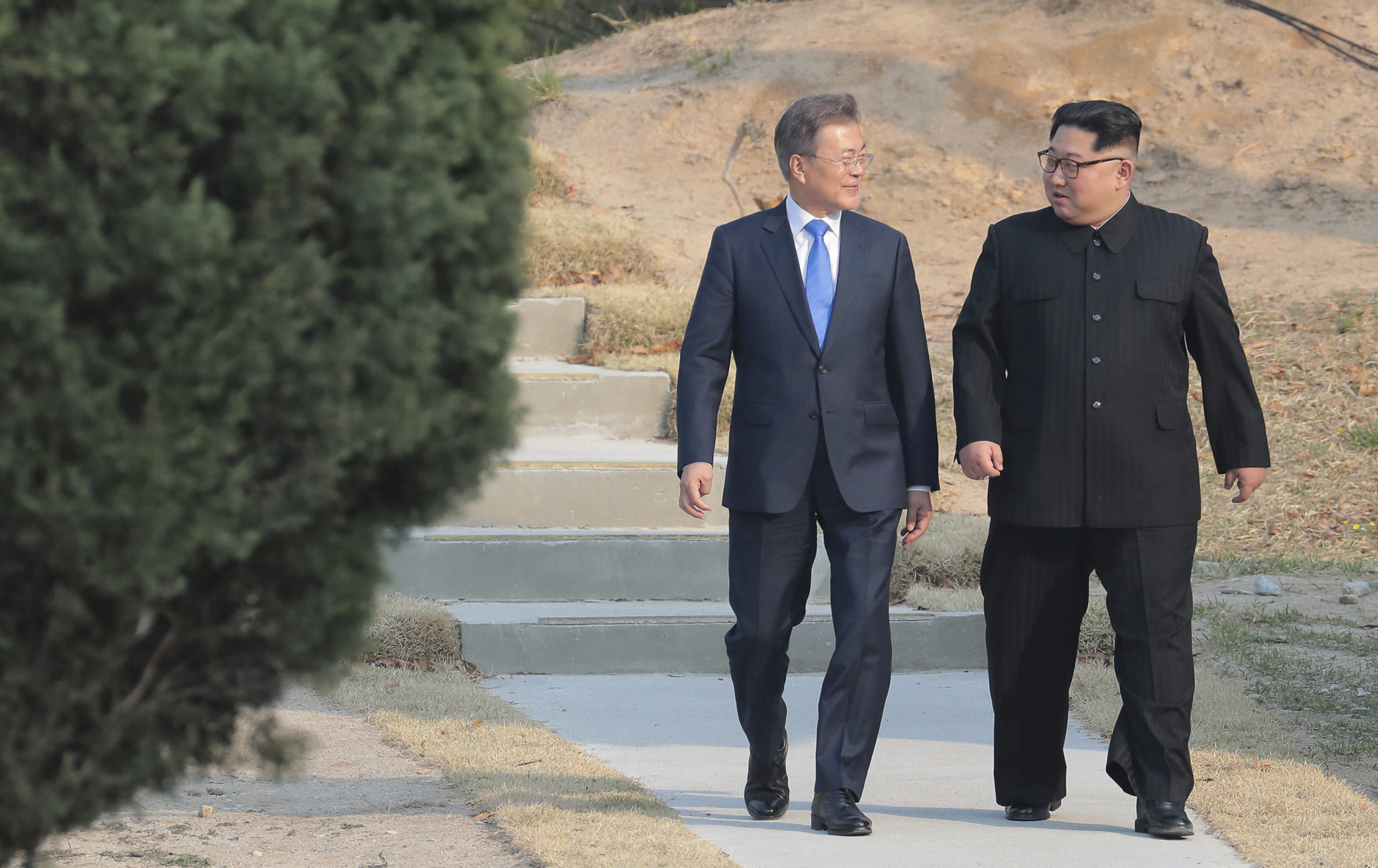 FILE - In this April 27, 2018 file photo, North Korean leader Kim Jong Un, right, and South Korean President Moon Jae-in stroll together at the border village of Panmunjom in the Demilitarized Zone, South Korea. North Korea on Saturday, June 13, 2020 again bashed South Korea, telling its rival to stop “nonsensical” talk about its denuclearization and vowing to expand its military capabilities. (Korea Summit Press Pool via AP, File)