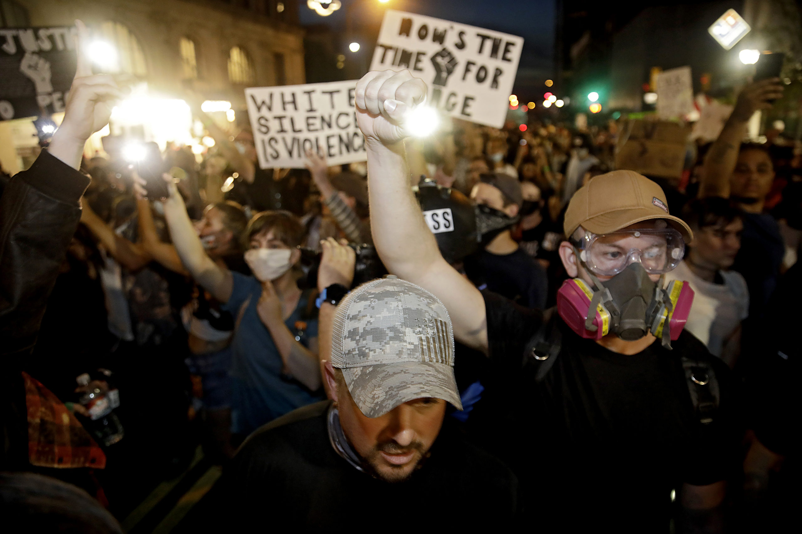 Protesters fill Boulder Ave. after Tulsa Police fired pepper balls at them after President Donald Trump's campaign rally at the BOK Center in Tulsa, Saturday, June 20, 2020.(Mike Simons/Tulsa World via AP)