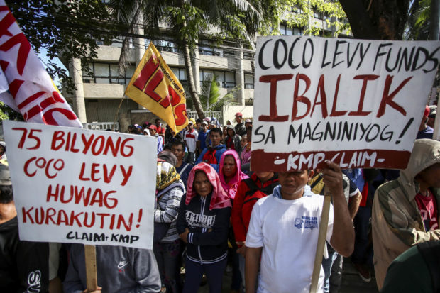  Farmers demanding justice and the return of the multibillion-peso coconut levy fund rally at the Philippine Coconut Authority in this Jan. 15, 2019 photo.