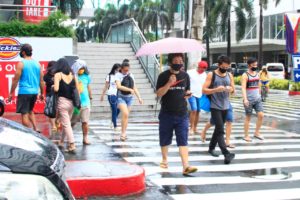 'Puno na lahat': Metro workers brave lack of public transport, rains, on Day 1 of GCQ