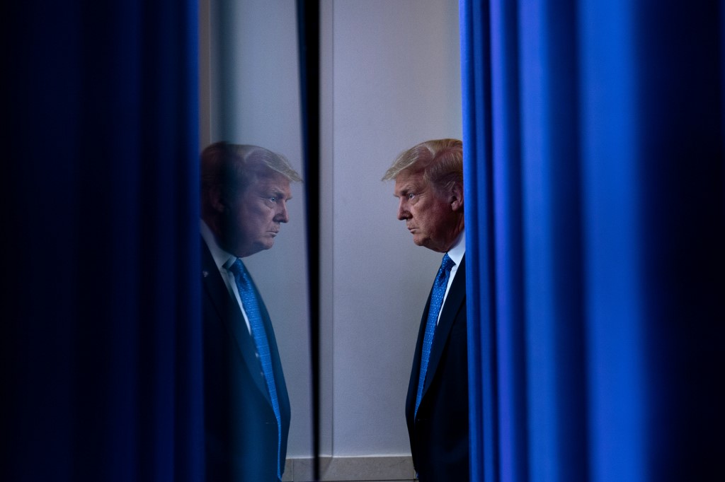 US President Donald Trump arrives to speak to the press ahead of the renewed briefing of the Coronavirus Task Force in the Brady Briefing Room of the White House in Washington, DC, on July 22, 2020. (Photo by Brendan Smialowski / AFP)