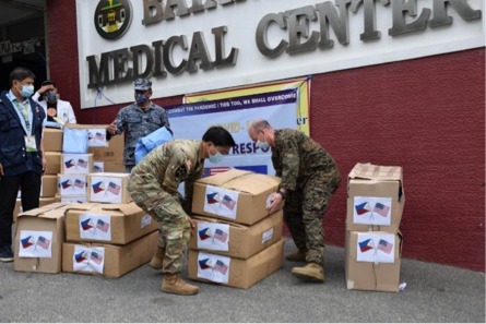 US military and Philippine Coast Guard service members unload PPE donations at the Batangas Medical Center. Photo courtesy of US Embassy in Manila
