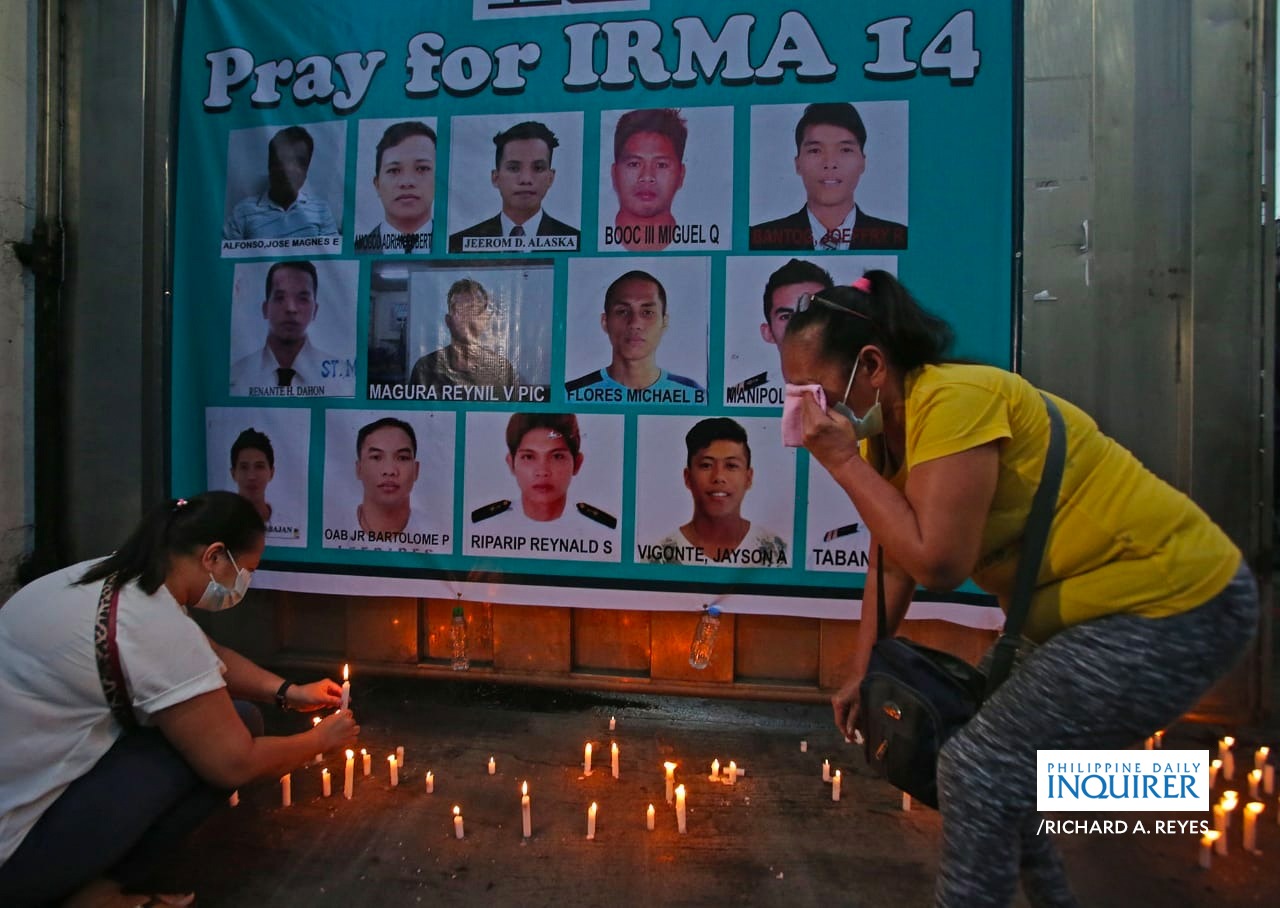 Families and relatives cry during prayer vigil at Irma Fishing and Trading Inc in Malabon for 12 fishermen and two passengers who went missing after their fishing boat Liberty 5 collided with the Hong Kong-flagged cargo ship Vienna Wood and sank in waters off Mamburao in Occidental Mindoro. They call for Philippine Coastguard not to stop the search and rescue operation. RICHARD A. REYES / INQUIRER