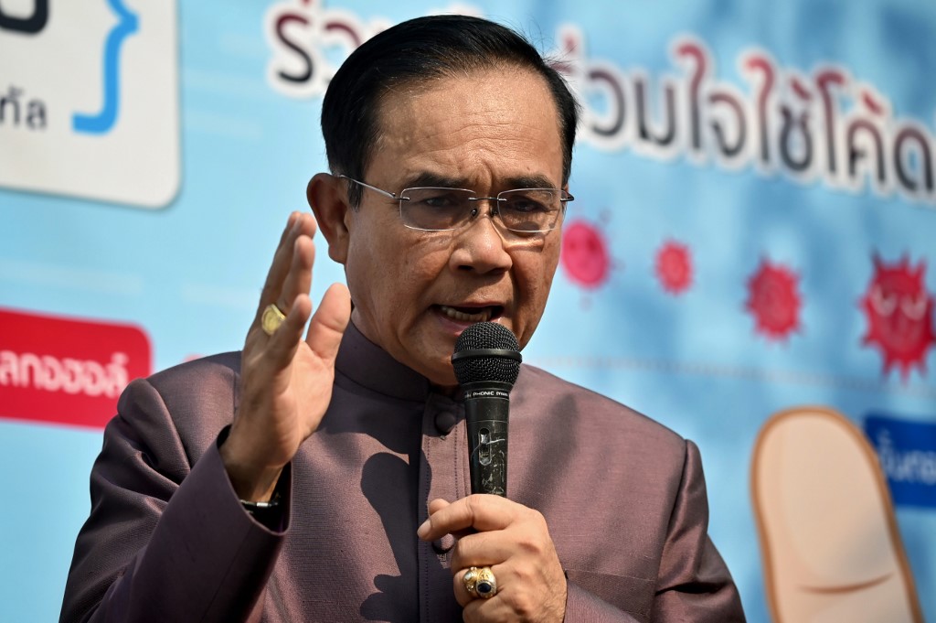 Thai Prime Minister Prayut Chan-O-Cha speaks during a demonstration by coding students on how to properly wash hands, amid concerns over the spread of the COVID-19 coronavirus, before a cabinet meeting at Government House in Bangkok on March 10, 2020. (Photo by Lillian SUWANRUMPHA / AFP)