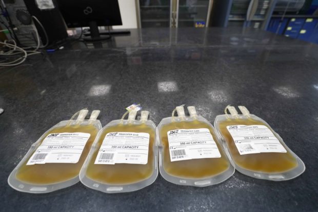 Plasma received from people who recovered from Covid-19 are pictured at the National Blood Transfusion centre in Cairo on July 22, 2020. (Photo by Khaled DESOUKI / AFP)