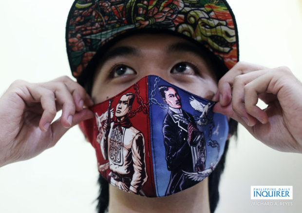Gelo Verano wears a facemask with images of national heroes Andres Bonifacio and Jose Rizal