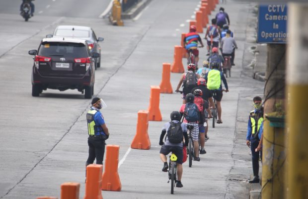 EXCLUSIVE LANE Cyclists try out the bike lane on Edsa, which formally opened on Saturday. Composed of six sections, it stretches from Edsa Aurora to Magallanes southbound. —NIÑO JESUS ORBETA