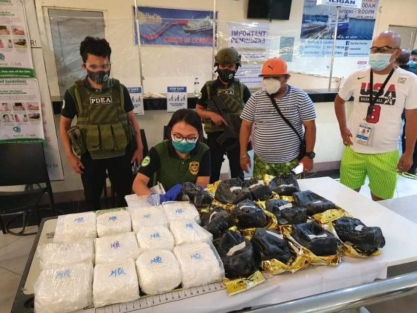 Agents of the Philippine Drug Enforcement Agency in Central Visayas conduct an inventory after they seized 12 packs of shabu concealed inside Chinese tea packs wrapped in black rubber material at a warehouse in Mandaue City last Saturday. (Photo courtesy of PDEA-7)