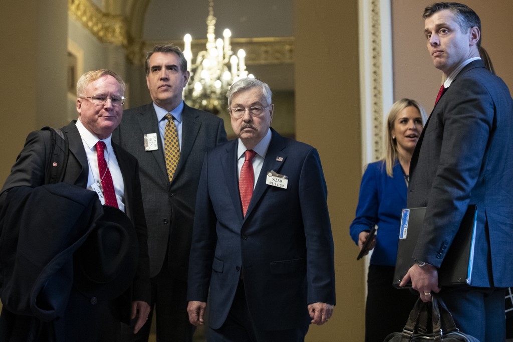 WASHINGTON, DC JANUARY 14: United States Ambassador to China Terry Branstad (C) exits the office of Senate Majority Leader Mitch McConnell's office at the U.S. Capitol on January 14, 2020 in Washington, DC. Senate Majority Leader Mitch McConnell (R-KY) announced that U.S. President Donald Trump's impeachment trial will begin in the Senate on Tuesday, January 21.   Drew Angerer/Getty Images/AFP