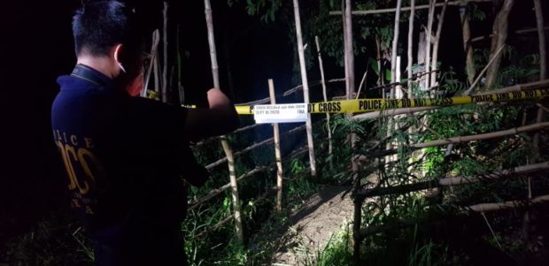 Police inspect the crime scene where two kidnap suspects were killed in Rizal